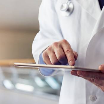 doctor holding a tablet