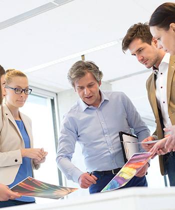 Rehberlik colleagues reviewing images in a meeting