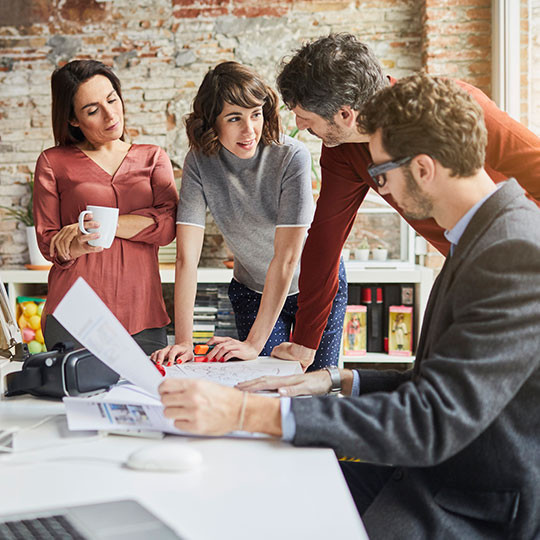 small group of colleagues having a discussion